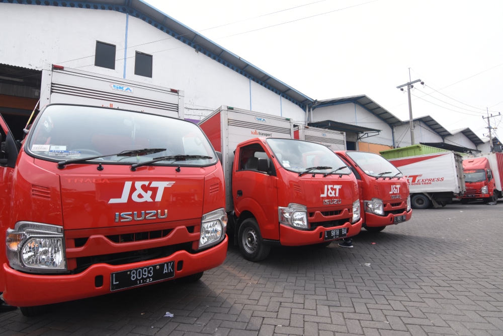 Delivery trucks waiting for cargo in a fleet center.