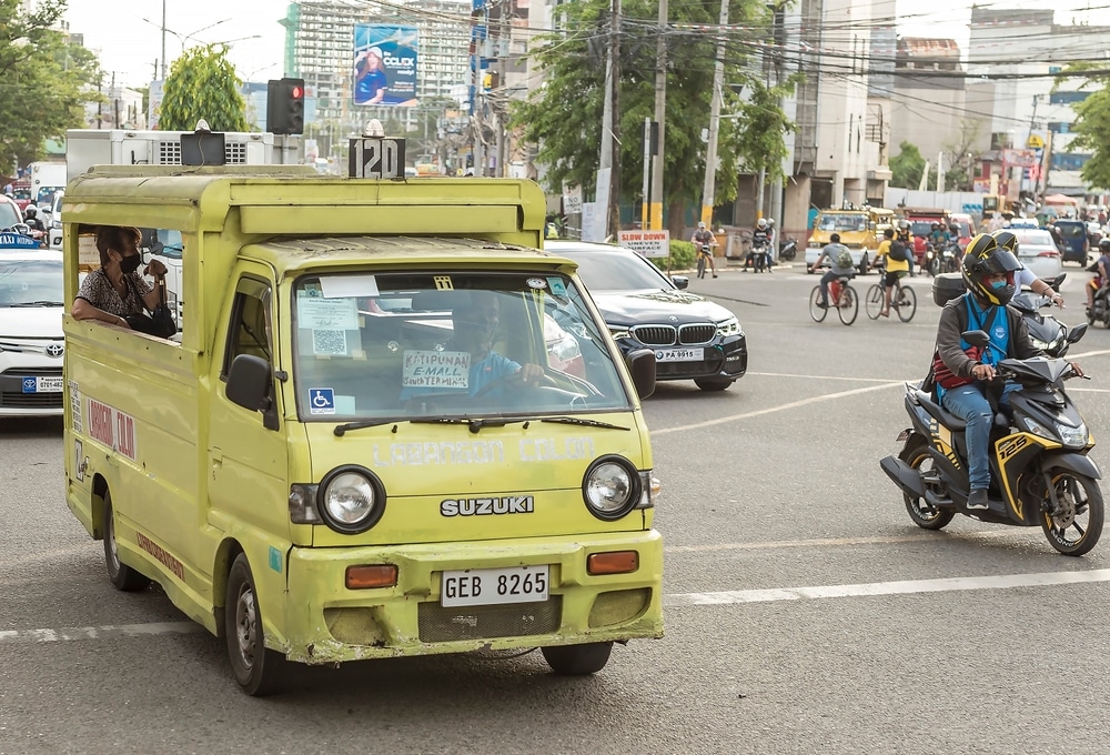A typical Cebuano Multicab jeepney. A Suzuki Carry model utilized as a passenger vehicle.